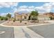 Beautiful single-story home featuring a three-car garage, desert landscaping, and a tile roof at 9410 Stone Castle Way, Las Vegas, NV 89123