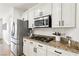Well-equipped kitchen featuring stainless steel appliances and beautiful countertops at 9410 Stone Castle Way, Las Vegas, NV 89123