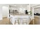 Kitchen with a center island, granite countertops, stainless steel appliances, and bar stool seating at 9410 Stone Castle Way, Las Vegas, NV 89123