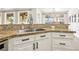 Elegant kitchen featuring a stainless steel sink, granite countertops, and sleek cabinetry at 9410 Stone Castle Way, Las Vegas, NV 89123