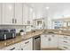 Beautiful kitchen with a stainless steel sink, granite countertops, and ample cabinet space at 9410 Stone Castle Way, Las Vegas, NV 89123
