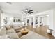 Expansive living room with open layout and seamless flow to other living areas at 9410 Stone Castle Way, Las Vegas, NV 89123