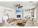 Bright and airy living room featuring a fireplace and custom built-ins at 9410 Stone Castle Way, Las Vegas, NV 89123
