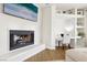 Close-up of the fireplace with TV and built-in desk in a well-lit living room at 9410 Stone Castle Way, Las Vegas, NV 89123