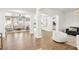 Bright and airy living space featuring hardwood floors, white pillars, and modern furnishings at 9410 Stone Castle Way, Las Vegas, NV 89123