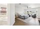 Spacious primary bedroom suite with hardwood flooring and sitting area at 9410 Stone Castle Way, Las Vegas, NV 89123