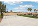 Outdoor sport court with basketball hoop and tennis net in a well-maintained backyard at 9410 Stone Castle Way, Las Vegas, NV 89123