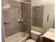 Bathroom features tub, shower, toilet, tile walls and large vanity mirror at 9600 Pacific View Dr, Las Vegas, NV 89117