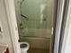 Bathroom featuring shower and tub combo, grab bar and tile at 9600 Pacific View Dr, Las Vegas, NV 89117