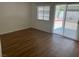 Spacious bedroom with laminate flooring and sliding glass door to the backyard at 9600 Pacific View Dr, Las Vegas, NV 89117