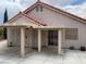 An exterior view of a covered patio with access to the home via a slider at 9600 Pacific View Dr, Las Vegas, NV 89117