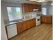 Well-lit kitchen featuring wood cabinets, modern appliances, and granite countertops at 9600 Pacific View Dr, Las Vegas, NV 89117