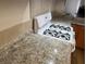 Close-up of granite countertops, a white stove, and tiled backsplash at 9600 Pacific View Dr, Las Vegas, NV 89117