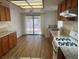 Kitchen featuring wood cabinets, granite countertops, stainless steel appliances, and hardwood floors at 9600 Pacific View Dr, Las Vegas, NV 89117