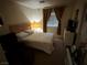 Comfortable bedroom with a full-sized bed and neutral decor, creating a cozy atmosphere at 977 Country Skies Ave, Las Vegas, NV 89123