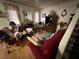 Cozy living room with wood floors and large windows providing plenty of natural light at 977 Country Skies Ave, Las Vegas, NV 89123