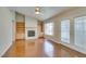 Stylish living area showcasing hardwood floors, fireplace, and built-in shelves, blending comfort and elegance at 10009 Netherton Dr, Las Vegas, NV 89134