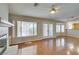 Bright living room, showing hardwood floors, fireplace, outdoor access and open access to the kitchen at 10009 Netherton Dr, Las Vegas, NV 89134