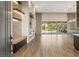Spacious living room with a modern fireplace, wood floors, and sliding glass doors to backyard at 10179 Emerald Sunset Ct, Las Vegas, NV 89148