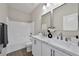 Bright bathroom with double vanity, white marble counters, and shower/tub combo at 10270 Turkish Pine Ct, Las Vegas, NV 89166