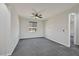 Bedroom with gray carpet, ceiling fan and natural light at 10270 Turkish Pine Ct, Las Vegas, NV 89166
