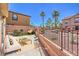 Landscaped backyard with patio furniture, potted plants and an egg chair at 1097 Paradise Resort Dr, Henderson, NV 89002