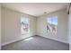 Bright bedroom with neutral carpet and two windows providing natural light at 1097 Paradise Resort Dr, Henderson, NV 89002