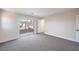 Spacious bedroom with neutral carpet and a sliding glass door leading to the balcony at 1097 Paradise Resort Dr, Henderson, NV 89002