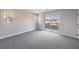 Bright bedroom with plush carpet and sliding glass doors to an outdoor patio at 1097 Paradise Resort Dr, Henderson, NV 89002