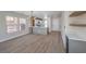 Spacious open-concept living area featuring sleek floors and a modern kitchen with breakfast bar at 1097 Paradise Resort Dr, Henderson, NV 89002