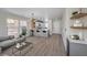 Open-concept living area showcasing a modern kitchen, sleek breakfast bar, and comfortable seating at 1097 Paradise Resort Dr, Henderson, NV 89002