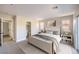 Bright main bedroom with natural light, carpeted floors, a walk-in closet, and an attached bathroom at 1097 Paradise Resort Dr, Henderson, NV 89002