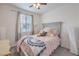 Cozy bedroom featuring natural light, soft carpeting and comfortable furnishings at 1120 Tektite Ave, Henderson, NV 89011
