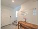 Bright foyer with tile flooring and decorative wall decor leading to the staircase at 1120 Tektite Ave, Henderson, NV 89011