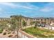 View of the community, showcasing well-maintained lawns, landscaping, and residential buildings at 1120 Tektite Ave, Henderson, NV 89011
