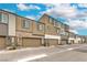 Street view of modern townhomes, showcasing garages and architectural details at 1120 Tektite Ave, Henderson, NV 89011