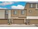 Close-up view of modern townhomes featuring garages and architectural design at 1120 Tektite Ave, Henderson, NV 89011