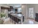 Eat-in kitchen featuring stainless steel appliances, a granite island, and tile flooring at 1120 Tektite Ave, Henderson, NV 89011