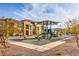 Community playground featuring modern play equipment, shading, and landscaping at 1120 Tektite Ave, Henderson, NV 89011