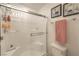 Clean and well-lit tiled shower with glass door, built-in bench, and wall storage at 1120 Tektite Ave, Henderson, NV 89011