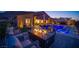 Stunning backyard with a pool, comfortable seating area, and a modern fire pit feature, perfect for evening relaxation at 11248 Rebel Dome Ct, Las Vegas, NV 89141