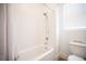 Clean bathroom with a bathtub, tiled walls, and a showerhead, providing a functional and simple design at 11248 Rebel Dome Ct, Las Vegas, NV 89141
