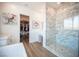 Modern bathroom with marble shower, large vanity and access to the walk-in closet at 11248 Rebel Dome Ct, Las Vegas, NV 89141