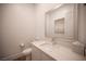Stylish powder room with a modern vanity, large mirror, and neutral decor at 11248 Rebel Dome Ct, Las Vegas, NV 89141
