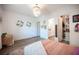 Bright bedroom featuring a walk-in closet, light walls, and wood-look floors for a cozy atmosphere at 11248 Rebel Dome Ct, Las Vegas, NV 89141
