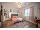 Serene bedroom featuring a tufted headboard, soft lighting, and tasteful decor for a relaxing ambiance at 11248 Rebel Dome Ct, Las Vegas, NV 89141