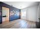 Open bedroom with an accent wall, modern lighting, and a view into the closet through a door at 11248 Rebel Dome Ct, Las Vegas, NV 89141