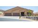 Attractive single-story home featuring a three-car garage, well-maintained landscaping, and a welcoming entrance at 11248 Rebel Dome Ct, Las Vegas, NV 89141