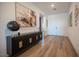 Elegant foyer with wood floors, modern decor, and a front door with sidelights at 11248 Rebel Dome Ct, Las Vegas, NV 89141