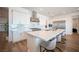 A gourmet kitchen with stainless steel appliances, white cabinets, and a large island at 11248 Rebel Dome Ct, Las Vegas, NV 89141
